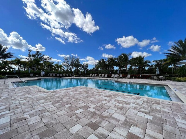 view of swimming pool featuring a patio