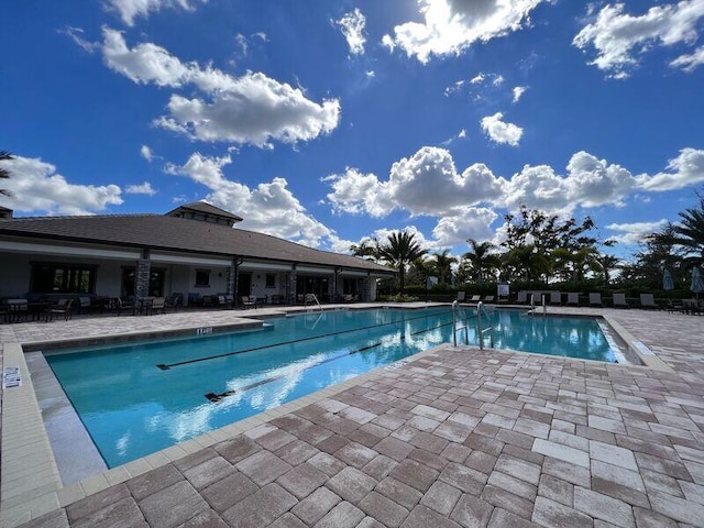 view of swimming pool featuring a patio area