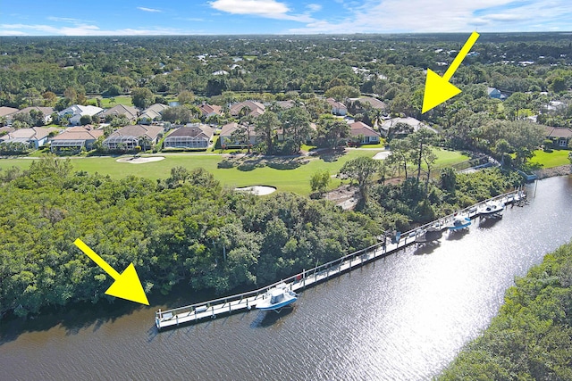 drone / aerial view with a water view and a residential view