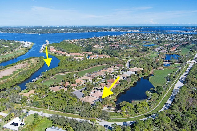 birds eye view of property with a water view and a residential view