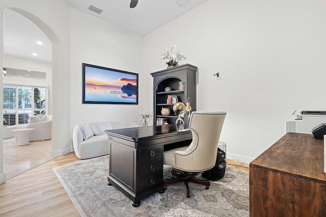 office area with wood-type flooring and ceiling fan