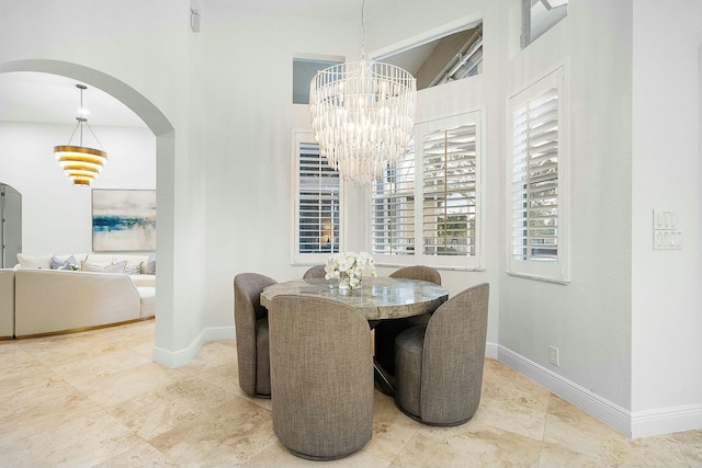 dining area featuring a notable chandelier