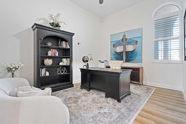 office featuring hardwood / wood-style flooring and ceiling fan