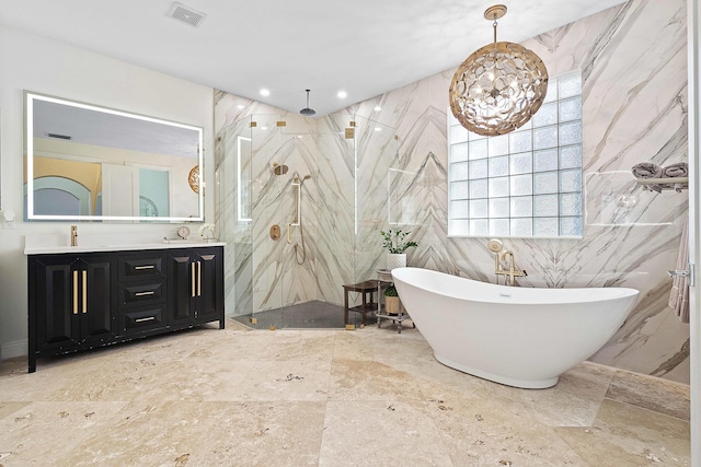 bathroom with tile walls, vanity, and shower with separate bathtub