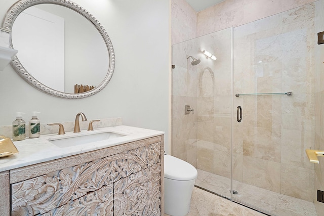 bathroom featuring vanity, toilet, and an enclosed shower