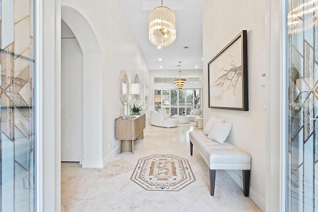 foyer featuring a chandelier