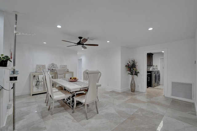 dining room with ceiling fan and washer and dryer