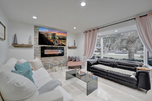 living room featuring a fireplace and plenty of natural light