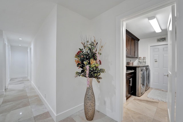 hallway with separate washer and dryer