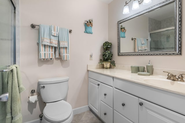 bathroom with toilet, vanity, walk in shower, and tile patterned flooring