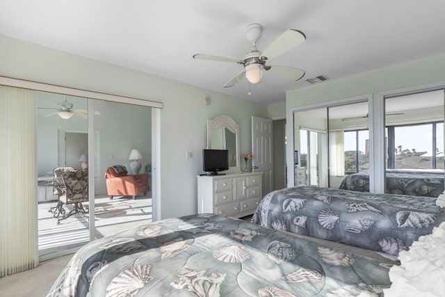 bedroom featuring ceiling fan and light carpet