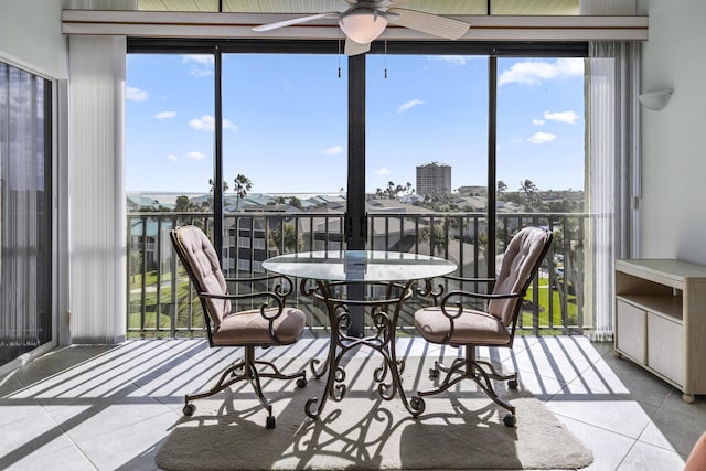 sunroom featuring ceiling fan