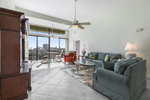 living room featuring ceiling fan and light tile patterned floors