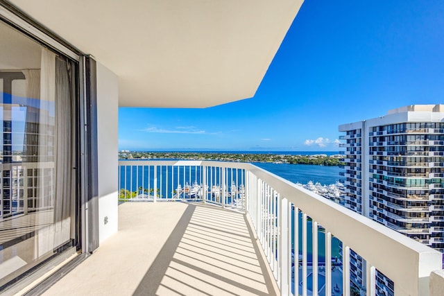 balcony featuring a water view