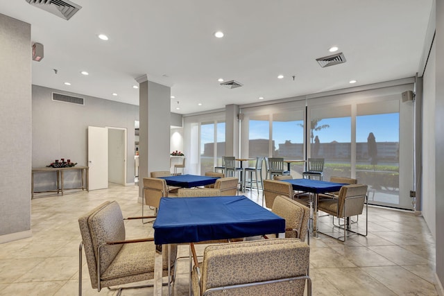 dining room with a wall of windows, plenty of natural light, and billiards