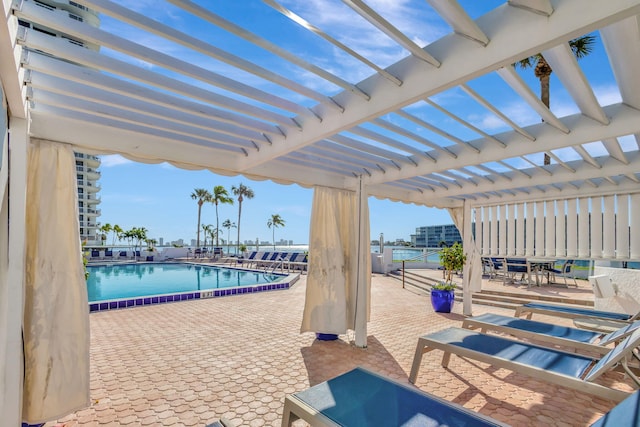 exterior space with a pergola and a community pool