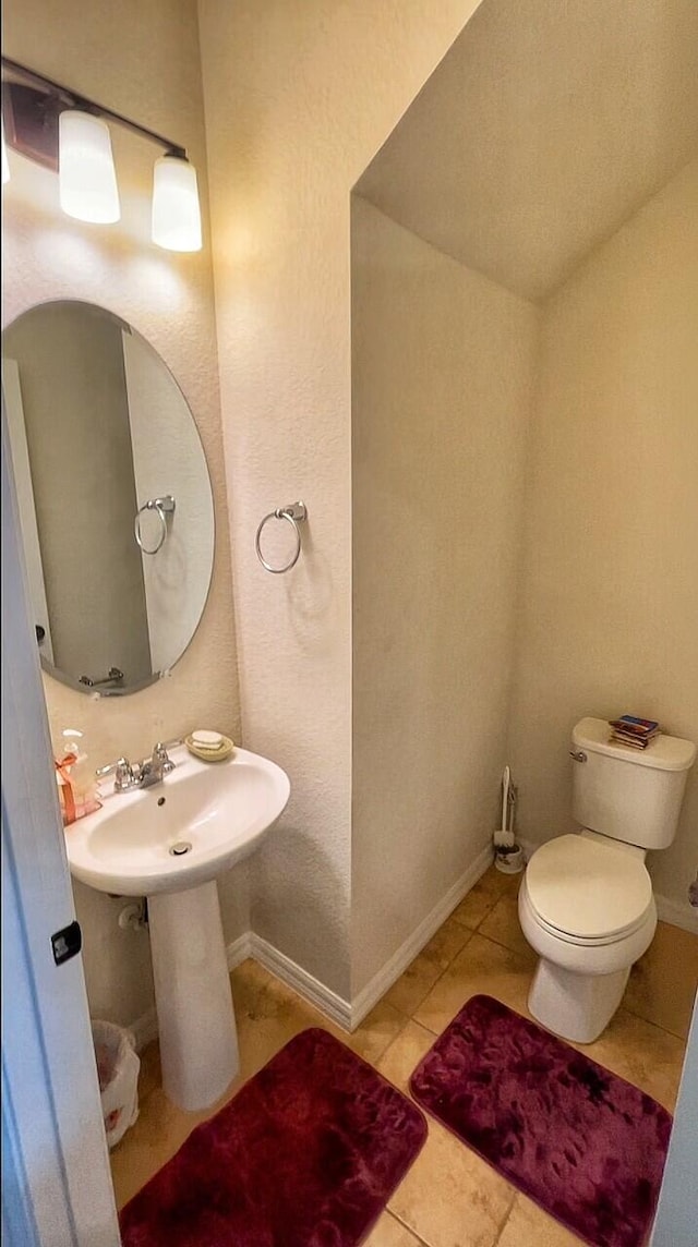 bathroom with tile patterned floors and toilet