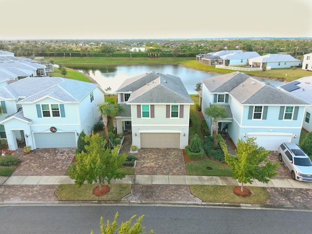 birds eye view of property featuring a water view