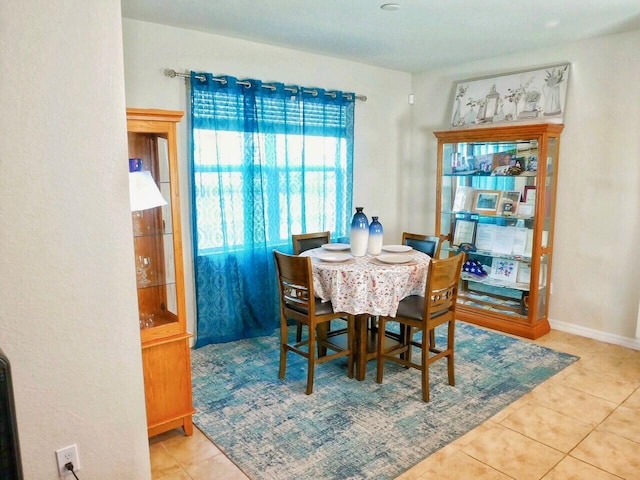 dining room featuring light tile patterned flooring