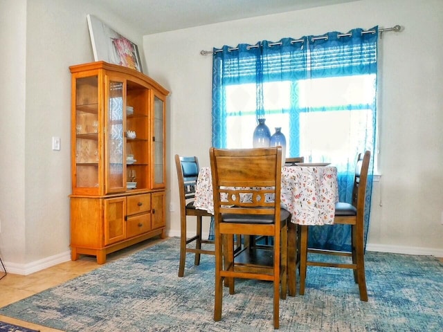 dining area featuring tile patterned floors