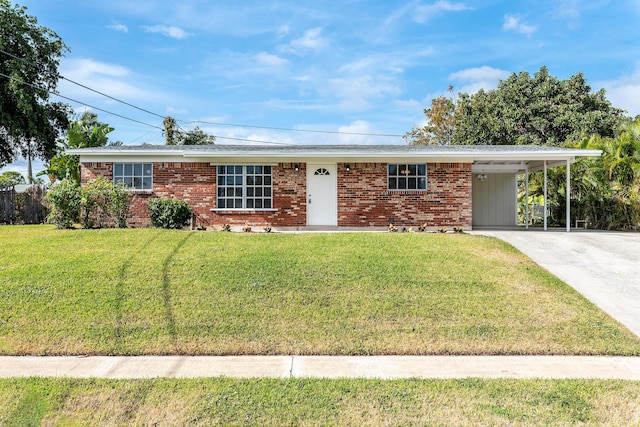 single story home featuring a front lawn and a carport