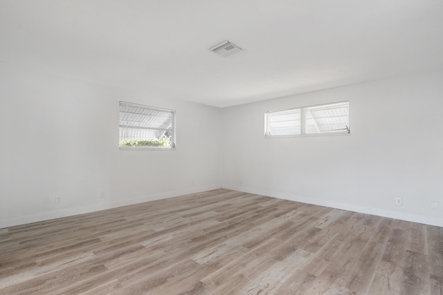 unfurnished room featuring light hardwood / wood-style floors