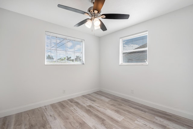 spare room featuring ceiling fan and light hardwood / wood-style flooring