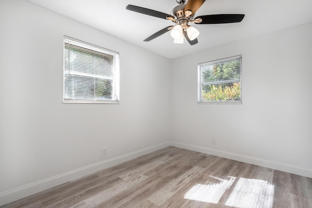 unfurnished room featuring ceiling fan and light hardwood / wood-style flooring