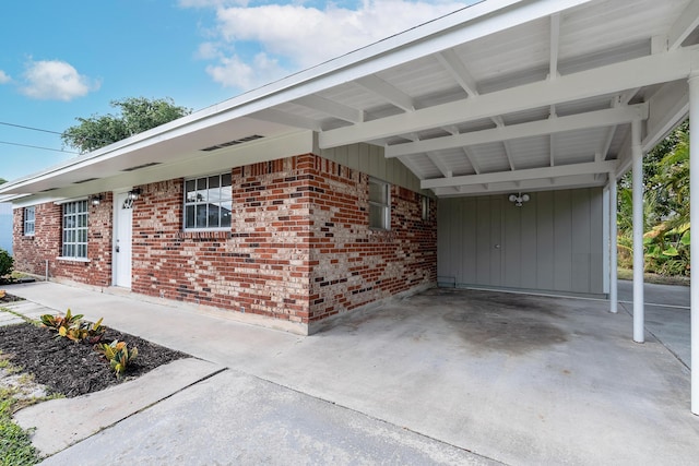 view of side of home featuring a carport