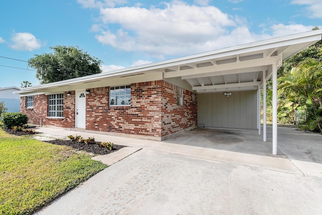 ranch-style house featuring a carport