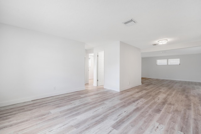 unfurnished room with light hardwood / wood-style floors