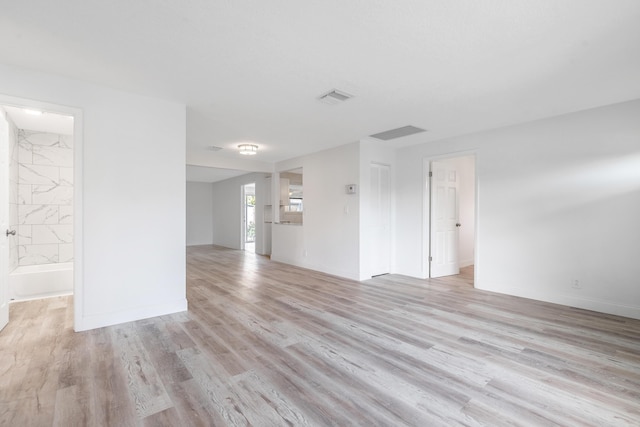 unfurnished room with light hardwood / wood-style flooring