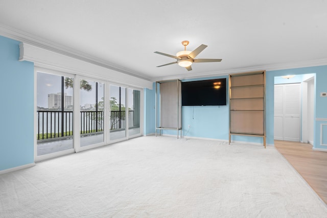 unfurnished living room with hardwood / wood-style flooring, ceiling fan, and crown molding