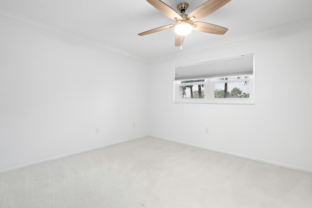 unfurnished room featuring carpet floors, ceiling fan, and crown molding