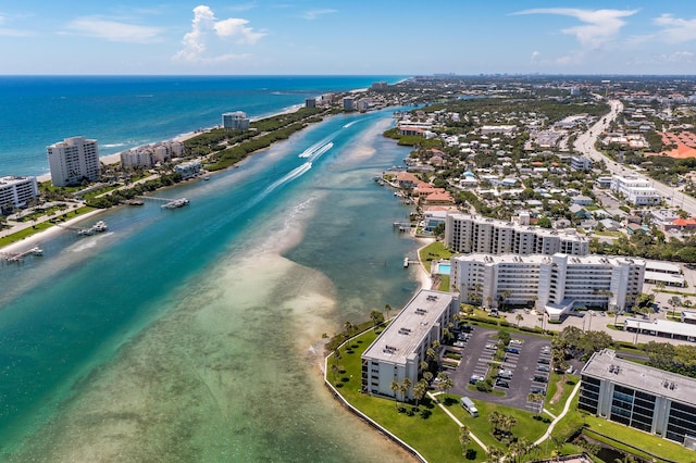 aerial view with a water view and a view of the beach