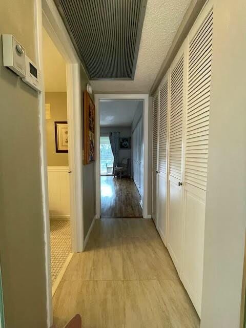 hallway with light wood-type flooring