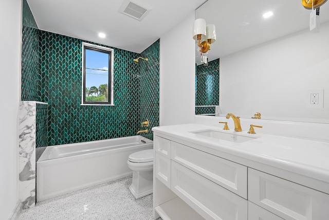 full bathroom with vanity, tiled shower / bath combo, toilet, and tile patterned flooring