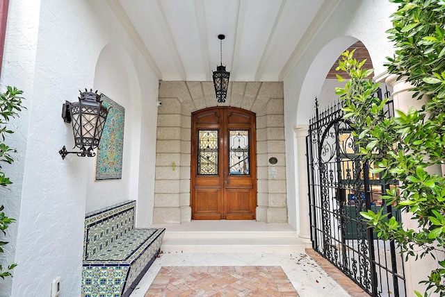 view of exterior entry featuring french doors