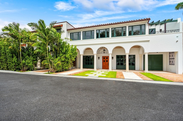 mediterranean / spanish home with stucco siding