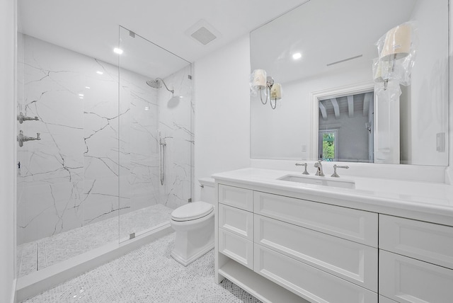 full bathroom featuring a marble finish shower, visible vents, vanity, and toilet