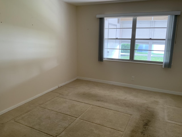1011 Guildford A 1011, Boca Raton, FL 33434 - spare room featuring baseboards