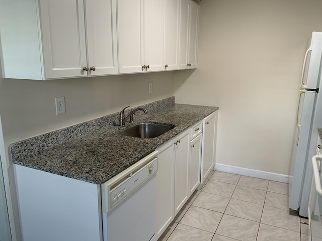 kitchen with sink, white cabinets, and white appliances