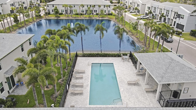 view of pool with a water view