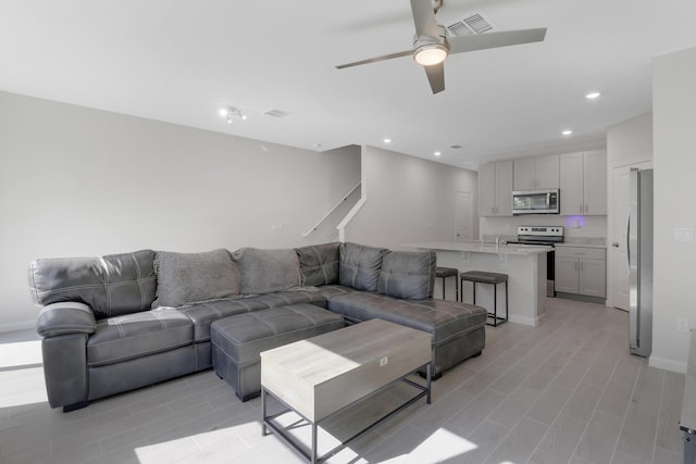 living room featuring ceiling fan