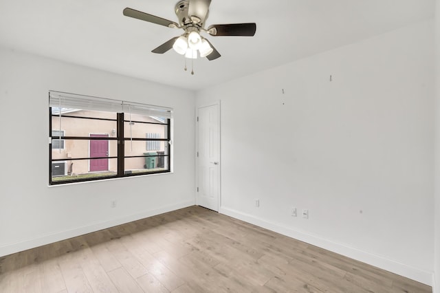 unfurnished room with light wood-type flooring and ceiling fan