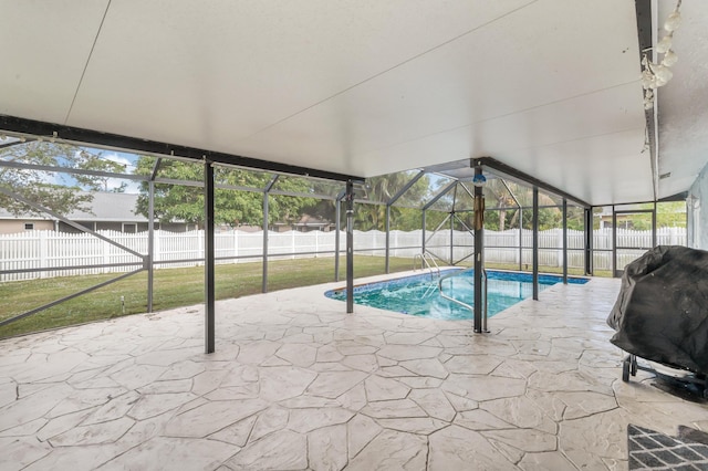 view of pool featuring a patio area, a yard, area for grilling, and glass enclosure