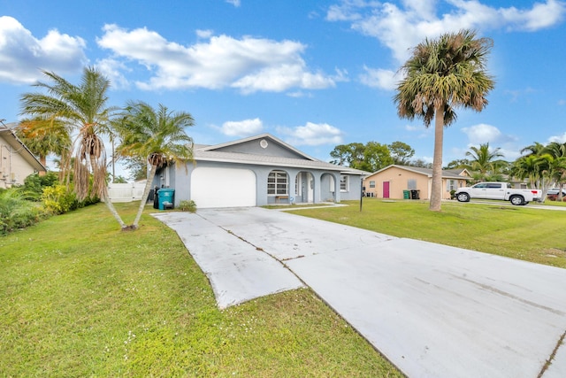 single story home featuring a garage and a front yard