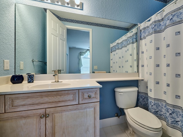 bathroom featuring tile patterned floors, a shower with curtain, vanity, and toilet