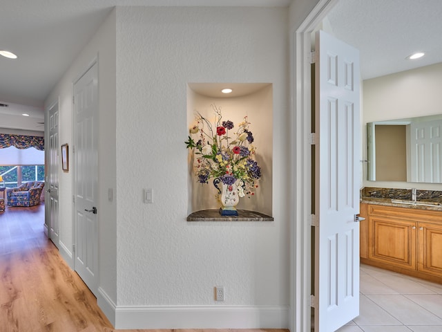 hallway featuring sink