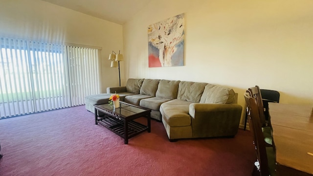 living room featuring vaulted ceiling and dark colored carpet